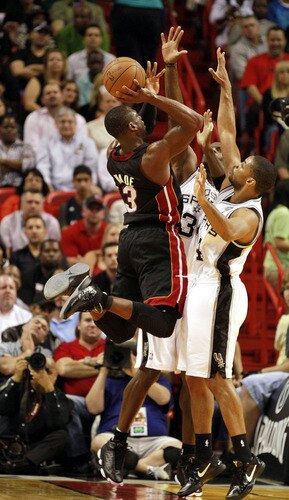 MIAMI - MARCH 14:  Guard Dwyane Wade #3 of the Miami Heat shoots against the San Antonio Spurs at American Airlines Arena on March 14, 2011 in Miami, Florida. <br /><br /><span class="help">(Photo by Marc Serota/Getty Images)</span>