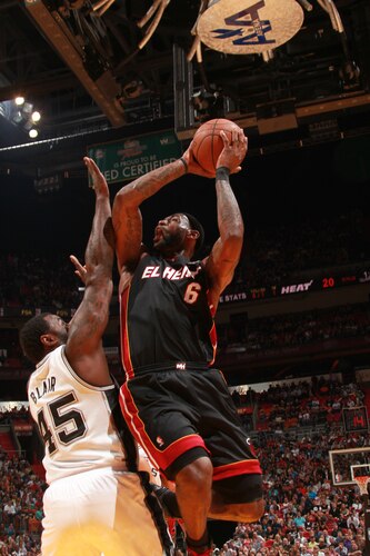 MIAMI - MARCH 14:  LeBron James #6 of the Miami Heat shoots against DeJuan Blair #45 of the San Antonio Spurs on March 14, 2011 at American Airlines Arena in Miami, Florida. <br /><br /><span class="help">(Photo by Victor Baldizon/NBAE via Getty Images)</span>