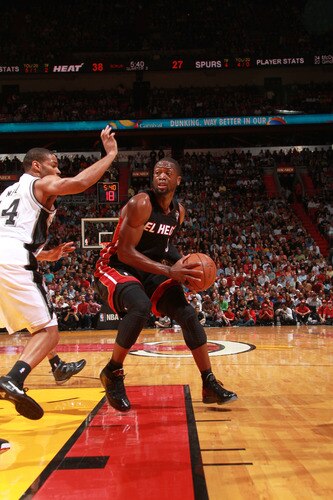 MIAMI - MARCH 14:  Dwyane Wade #3 of the Miami Heat in action against Gary Neal #14 of the San Antonio Spurs on March 14, 2011 at American Airlines Arena in Miami, Florida. <br /><br /><span class="help">(Photo by Victor Baldizon/NBAE via Getty Images)</span>