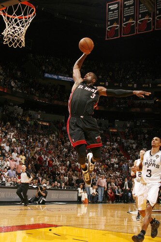 MIAMI - MARCH 14: Dwyane Wade #3 of the Miami Heat dunks against the San Antonio Spurs on March 14, 2011 at American Airlines Arena in Miami, Florida. <br /><br /><span class="help">(Photo by Issac Baldizon/NBAE via Getty Images)</span>
