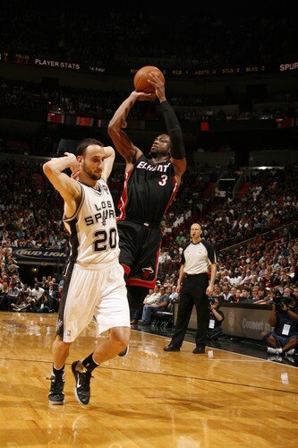 MIAMI - MARCH 14: Dwyane Wade #3 of the Miami Heat shoots against Manu Ginobili #20 of the San Antonio Spurs on March 14, 2011 at American Airlines Arena in Miami, Florida. <br /><br /><span class="help">(Photo by Issac Baldizon/NBAE via Getty Images)</span>
