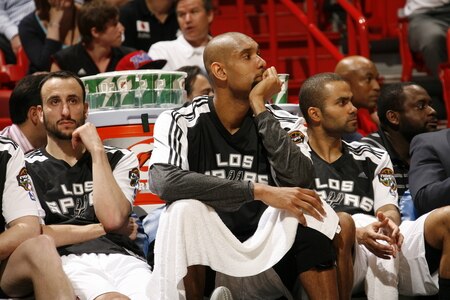 MIAMI - MARCH 14: Manu Ginobili #20 Tim Duncan #21 and Tony Parker #9 of the San Antonio Spurs look dejected sitting on the bench  during a game against the Miami Heat on March 14, 2011 at American Airlines Arena in Miami, Florida. <br /><br /><span class="help">(Photo by Issac Baldizon/NBAE via Getty Images)</span>