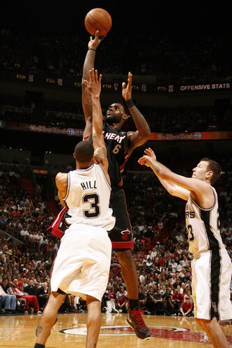 MIAMI - MARCH 14: LeBron James #6 of the Miami Heat shoots against George Hill #3 of the San Antonio Spurs on March 14, 2011 at American Airlines Arena in Miami, Florida. <br /><br /><span class="help">(Photo by Issac Baldizon/NBAE via Getty Images)</span>