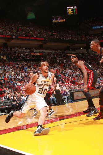 MIAMI - MARCH 14:  Manu Ginobili #20 of the San Antonio Spurs drives against the Miami Heat on March 14, 2011 at American Airlines Arena in Miami, Florida. <br /><br /><span class="help">(Photo by Victor Baldizon/NBAE via Getty Images)</span>