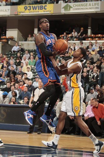 INDIANAPOLIS, IN - MARCH 15:  Amar'e Stoudemire #1 of the New York Knicks shoots against Paul George #24 of the Indiana Pacers on March 15, 2011 at Conseco Fieldhouse in Indianapolis, Indiana.  <br /><br /><span class="help">(Photo by Ron Hoskins/NBAE via Getty Images)</span>