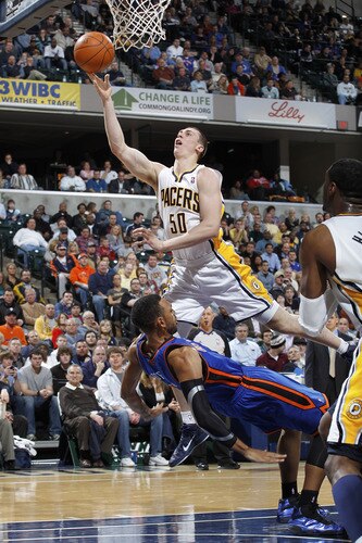 INDIANAPOLIS, IN - MARCH 15: Tyler Hansbrough #50 of the Indiana Pacers shoots over Jared Jeffries #9 of the New York Knicks on March 15, 2011 at Conseco Fieldhouse in Indianapolis, Indiana. The Pacers defeated the Knicks 119-117. <br /><br /><span class="help">(Photo by Joe Robbins/NBAE via Getty Images)</span>