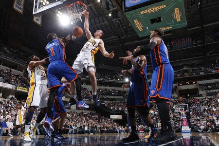 INDIANAPOLIS, IN - MARCH 15: Tyler Hansbrough #50 of the Indiana Pacers dunks over Amar'e Stoudemire #1 of the New York Knicks on March 15, 2011 at Conseco Fieldhouse in Indianapolis, Indiana. The Pacers defeated the Knicks 119-117. <br /><br /><span class="help">(Photo by Joe Robbins/NBAE via Getty Images)</span>