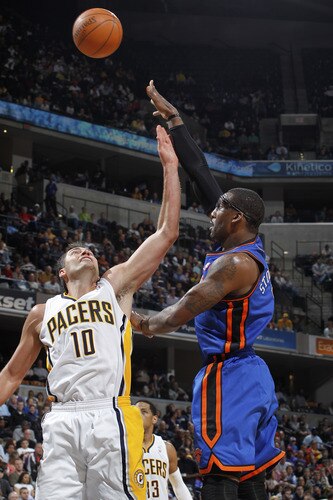 INDIANAPOLIS, IN - MARCH 15: Amar'e Stoudemire #1 of the New York Knicks shoots over Jeff Foster #10 of the Indiana Pacers on March 15, 2011 at Conseco Fieldhouse in Indianapolis, Indiana. The Pacers defeated the Knicks 119-117. <br /><br /><span class="help">(Photo by Joe Robbins/NBAE via Getty Images)</span>