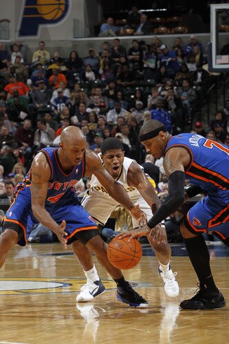 INDIANAPOLIS, IN - MARCH 15: Chauncey Billups #4 and Carmelo Anthony #7 of the New York Knicks reach for a loose ball against Paul George #24 of the Indiana Pacers on March 15, 2011 at Conseco Fieldhouse in Indianapolis, Indiana. The Pacers defeated the Knicks 119-117. <br /><br /><span class="help">(Photo by Joe Robbins/NBAE via Getty Images)</span>
