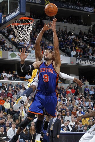 INDIANAPOLIS, IN - MARCH 15: Jared Jeffries #9 of the New York Knicks goes to the basket past Danny Granger #33 of the Indiana Pacers on March 15, 2011 at Conseco Fieldhouse in Indianapolis, Indiana. The Pacers defeated the Knicks 119-117. <br /><br /><span class="help">(Photo by Joe Robbins/NBAE via Getty Images)</span>