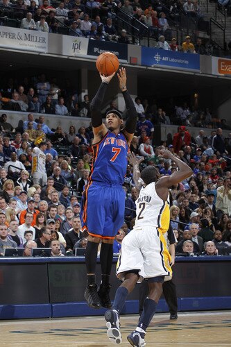 INDIANAPOLIS, IN - MARCH 15: Carmelo Anthony #7 of the New York Knicks shoots over Darren Collison #2 of the Indiana Pacers on March 15, 2011 at Conseco Fieldhouse in Indianapolis, Indiana. The Pacers defeated the Knicks 119-117. <br /><br /><span class="help">(Photo by Joe Robbins/NBAE via Getty Images)</span>