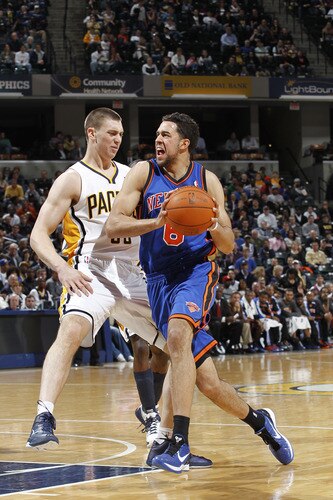 INDIANAPOLIS, IN - MARCH 15: Landry Fields #6 of the New York Knicks drives past Tyler Hansbrough #50 of the Indiana Pacers on March 15, 2011 at Conseco Fieldhouse in Indianapolis, Indiana. The Pacers defeated the Knicks 119-117. <br /><br /><span class="help">(Photo by Joe Robbins/NBAE via Getty Images)</span>