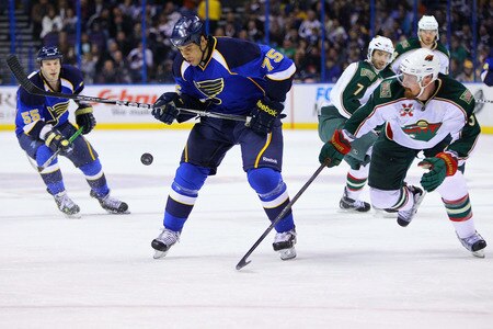 ST. LOUIS, MO - MARCH 29: Ryan Reaves #75 of the St. Louis Blues knocks the puck down against the Minnesota Wild at the Scottrade Center on March 29, 2011 in St. Louis, Missouri.  <br /><br /><span class="help">(Photo by Dilip Vishwanat/Getty Images)</span>