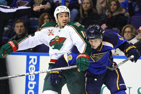 ST. LOUIS, MO - MARCH 29: Kevin Shattenkirk #12 of the St. Louis Blues defends against Brad Staubitz #16 of the Minnesota Wild at the Scottrade Center on March 29, 2011 in St. Louis, Missouri.  <br /><br /><span class="help">(Photo by Dilip Vishwanat/Getty Images)</span>