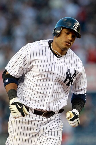 NEW YORK, NY - APRIL 26:  Robinson Cano #24 of the New York Yankees runs the bases after hitting a homer against the Chicago White Sox at Yankee Stadium on April 26, 2011 in the Bronx borough of New York City.  <br /><br /><span class="help">(Photo by Chris Trotman/Getty Images)</span>