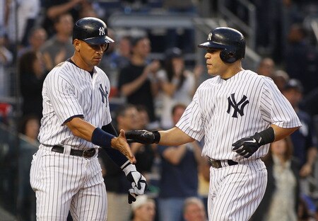 NEW YORK - MAY 21:  Russell Martin #55 of the New York Yankees is congradulated by teammate Alex Rodriguez #13 after hitting a two run home run in the bottom of the second inning against the New York Mets on May 21, 2011 at Yankee Stadium in the Bronx borough of New York City.  <br /><br /><span class="help">(Photo by Mike Stobe/Getty Images)</span>