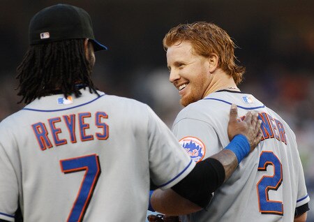 NEW YORK - MAY 21:  Justin Turner #2 of the New York Mets is padded on the back by teammate Jose Reyes #7 after driving in a run during the first inning on May 21, 2011 at Yankee Stadium in the Bronx borough of New York City.  <br /><br /><span class="help">(Photo by Mike Stobe/Getty Images)</span>