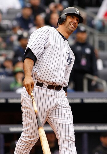 NEW YORK - MAY 22:  Jorge Posada #20 of the New York Yankees watches a fly ball just go foul missing a homerun against the New York Mets on May 22, 2011 at Yankee Stadium in the Bronx borough of New York City.  <br /><br /><span class="help">(Photo by Mike Stobe/Getty Images)</span>