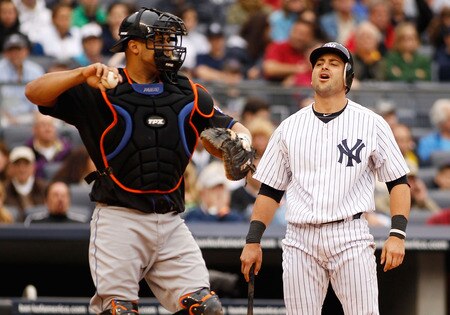 NEW YORK - MAY 22:  Francisco Cervelli #17 of the New York Yankees reacts after striking out with a man on second and nobody out as Ronny Paulino #9 of the New York Mets throws to third on May 22, 2011 at Yankee Stadium in the Bronx borough of New York City.  <br /><br /><span class="help">(Photo by Mike Stobe/Getty Images)</span>