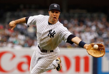 NEW YORK - MAY 22:  Mark Teixeira #25 of the New York Yankees shuffles the ball to Ivan Nova #47 (not pictured) for an out against the New York Mets on May 22, 2011 at Yankee Stadium in the Bronx borough of New York City.  <br /><br /><span class="help">(Photo by Mike Stobe/Getty Images)</span>