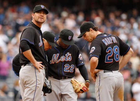 NEW YORK - MAY 22:  Mike Pelfrey #34 of the New York Mets is pulled in the seventh inning as teammates Daniel Murphy #28, Willie Harris #22, and manager Terry Collins #10 look on against the New York Yankees on May 22, 2011 at Yankee Stadium in the Bronx borough of New York City. Yankees defeat the Mets 9-3. <br /><br /><span class="help">(Photo by Mike Stobe/Getty Images)</span>
