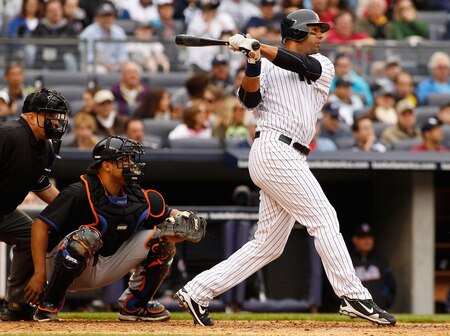 NEW YORK - MAY 22:  Chris Dickerson #27 of the New York Yankees hits a double in the seventh inning against the New York Mets on May 22, 2011 at Yankee Stadium in the Bronx borough of New York City. Yankees defeat the Mets 9-3. <br /><br /><span class="help">(Photo by Mike Stobe/Getty Images)</span>