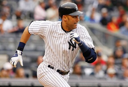 NEW YORK - MAY 22:  Derek Jeter #2 of the New York Yankees hits a two run single in the seventh inning to tie the game a three against the New York Mets on May 22, 2011 at Yankee Stadium in the Bronx borough of New York City. Yankees defeat the Mets 9-3.  <br /><br /><span class="help">(Photo by Mike Stobe/Getty Images)</span>