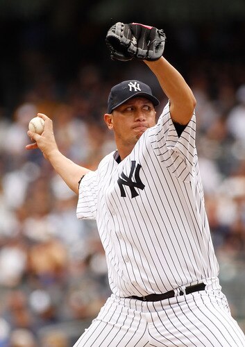 NEW YORK - JUNE 12:  Freddy Garcia #36 of the New York Yankees delivers a pitch in the first inning against the Cleveland Indians on June 12, 2011 at Yankee Stadium in the Bronx borough of New York City.  <br /><br /><span class="help">(Photo by Mike Stobe/Getty Images)</span>
