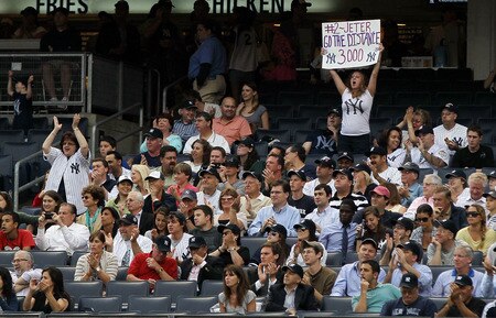 NEW YORK, NY - JUNE 13:  Fans of the New York Yankees react after Derek Jeter's first inning base hit against the Cleveland Indians on June 13, 2011 at Yankee Stadium in the Bronx borough of New York City.  <br /><br /><span class="help">(Photo by Jim McIsaac/Getty Images)</span>