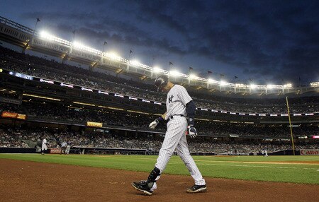 NEW YORK, NY - JUNE 13:  Derek Jeter #2 of the New York Yankees walks back to the dugout after flying out in the fifth inning against the Cleveland Indians on June 13, 2011 at Yankee Stadium in the Bronx borough of New York City. Jeter suffered a sore right calf on the play and left the game. <br /><br /><span class="help">(Photo by Jim McIsaac/Getty Images)</span>