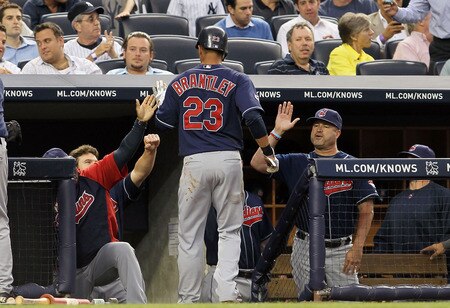 NEW YORK, NY - JUNE 13:  Michael Brantley #23 of the Cleveland Indians is congratulated after scoring in the fourth inning against the New York Yankees on June 13, 2011 at Yankee Stadium in the Bronx borough of New York City.  <br /><br /><span class="help">(Photo by Jim McIsaac/Getty Images)</span>