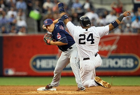 NEW YORK, NY - JUNE 13:  Robinson Cano #24 of the New York Yankees is forced out as Asdrubal Cabrera #13 of the Cleveland Indians throws to first base to complete a third inning ending double play on June 13, 2011 at Yankee Stadium in the Bronx borough of New York City.  <br /><br /><span class="help">(Photo by Jim McIsaac/Getty Images)</span>