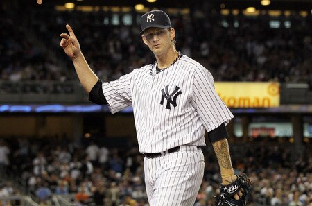 NEW YORK, NY - JUNE 13:  A.J. Burnett #34 of the New York Yankees salutes the crowd as he leaves the game in the eighth inning against the Cleveland Indians on June 13, 2011 at Yankee Stadium in the Bronx borough of New York City.  <br /><br /><span class="help">(Photo by Jim McIsaac/Getty Images)</span>