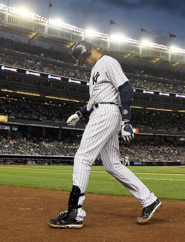 NEW YORK, NY - JUNE 13:  Derek Jeter #2 of the New York Yankees walks back to the dugout after flying out in the fifth inning against the Cleveland Indians on June 13, 2011 at Yankee Stadium in the Bronx borough of New York City. Jeter suffered a sore right calf on the play and left the game.  <br /><br /><span class="help">(Photo by Jim McIsaac/Getty Images)</span>