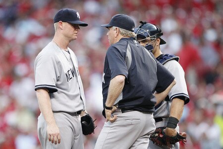 CINCINNATI, OH - JUNE 22: Brian Gordon #22 of the New York Yankees talks with pitching coach Larry Rothschild during the second game of a doubleheader against the Cincinnati Reds at Great American Ball Park on June 22, 2011 in Cincinnati, Ohio. <br /><br /><span class="help">(Photo by Joe Robbins/Getty Images)</span>