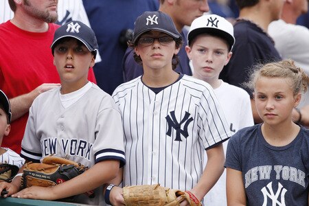 CINCINNATI, OH - JUNE 22: A group of young New York Yankees fans look on before the second game of a doubleheader against the Cincinnati Reds at Great American Ball Park on June 22, 2011 in Cincinnati, Ohio. <br /><br /><span class="help">(Photo by Joe Robbins/Getty Images)</span>