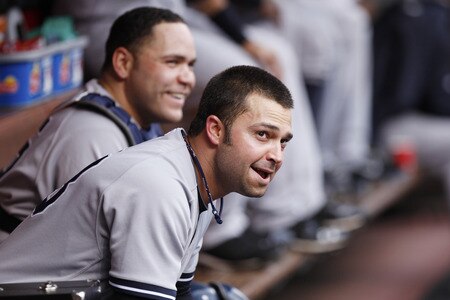CINCINNATI, OH - JUNE 22: Nick Swisher #33 and Russell Martin #55 of the New York Yankees look on during the second game of a doubleheader against the Cincinnati Reds at Great American Ball Park on June 22, 2011 in Cincinnati, Ohio. <br /><br /><span class="help">(Photo by Joe Robbins/Getty Images)</span>
