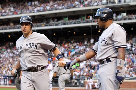 NEW YORK, NY - JULY 01: (L-R)  Mark Teixeira #25 of the New York Yankees celebrates scoring on a Robinson Cano double with teammate Andruw Jones #18 against the New York Mets at Citi Field on July 1, 2011 in the Flushing neighborhood of the Queens borough of New York City.  <br /><br /><span class="help">(Photo by Nick Laham/Getty Images)</span>