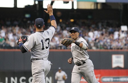 NEW YORK, NY - JULY 01: Robinson Cano #24 of the  of the New York Yankees celebrates an inning ending play with teammate Alex Rodriguez #13 against the New York Mets at Citi Field on July 1, 2011 in the Flushing neighborhood of the Queens borough of New York City.  <br /><br /><span class="help">(Photo by Nick Laham/Getty Images)</span>