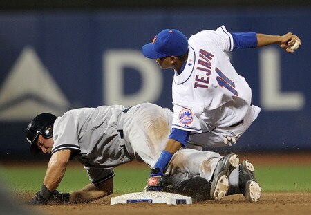 NEW YORK, NY - JULY 01: Russell Martin #55 of the New York Yankees breaks up a double play as Ruben Tejada #11 of the New York Mets falls to the ground at Citi Field on July 1, 2011 in the Flushing neighborhood of the Queens borough of New York City.  <br /><br /><span class="help">(Photo by Nick Laham/Getty Images)</span>