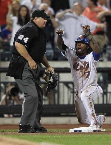 NEW YORK, NY - JULY 01:  Jose Reyes #7 of the New York Mets reacts after being called out at third by home plate umpire Jerry Layne #24 during the game against the New York Yankees at Citi Field on July 1, 2011 in the Flushing neighborhood of the Queens borough of New York City.  <br /><br /><span class="help">(Photo by Nick Laham/Getty Images)</span>