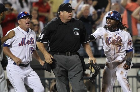 NEW YORK, NY - JULY 01:  Jose Reyes #7 of the New York Mets and third base coach Chip Hale #51 react after being called out at third by home plate umpire Jerry Layne #24 during the game against the New York Yankees at Citi Field on July 1, 2011 in the Flushing neighborhood of the Queens borough of New York City.  <br /><br /><span class="help">(Photo by Nick Laham/Getty Images)</span>