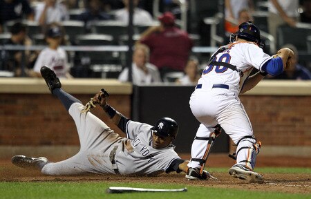 NEW YORK, NY - JULY 01:  Curtis Granderson #14 of the New York Yankees slides safely into home under the tag of catcher Josh Thole #30 of the New York Mets on an Alex Rodriguez double at Citi Field on July 1, 2011 in the Flushing neighborhood of the Queens borough of New York City.  <br /><br /><span class="help">(Photo by Nick Laham/Getty Images)</span>