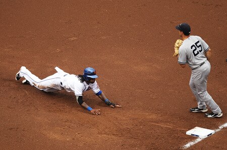 NEW YORK, NY - JULY 02:  Jose Reyes #7 of the New York Mets dives safely back to first base after getting caught in a rundown as Mark Teixeira #25 of the New York Yankees waits for the throw during their game on July 2, 2011 at Citi Field in the Flushing neighborhood of the Queens borough of New York City.  <br /><br /><span class="help">(Photo by Al Bello/Getty Images)</span>