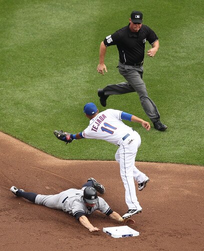 NEW YORK, NY - JULY 02:  Brett Gardner #11 of the New York Yankees safely steals second base as Ruben Tejada #11 of the New York Mets applies the tag during their game on July 2, 2011 at Citi Field in the Flushing neighborhood of the Queens borough of New York City.  <br /><br /><span class="help">(Photo by Al Bello/Getty Images)</span>