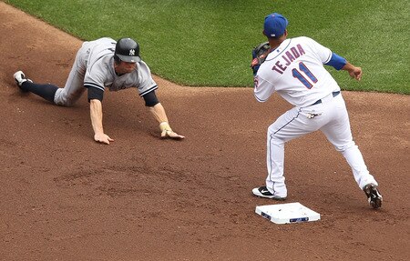 NEW YORK, NY - JULY 02:  Brett Gardner #11 of the New York Yankees safely steals second base as Ruben Tejada #11 of the New York Mets applies the tag during their game on July 2, 2011 at Citi Field in the Flushing neighborhood of the Queens borough of New York City.  <br /><br /><span class="help">(Photo by Al Bello/Getty Images)</span>