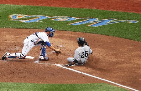 NEW YORK, NY - JULY 02:  Josh Thole #30 of the New York Mets tags out Eduardo Nunez #26 of the New York Yankees during their game on July 2, 2011 at Citi Field in the Flushing neighborhood of the Queens borough of New York City.  The home plate umpire is Brian Knight #91.  <br /><br /><span class="help">(Photo by Al Bello/Getty Images)</span>