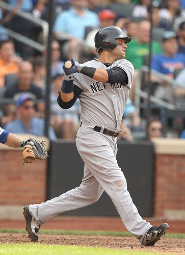 NEW YORK, NY - JULY 02:  Nick Swisher #33 of the New York Yankees drives in a run with a sacrifice fly in the sixth inning against the New York Mets during their game on July 2, 2011 at Citi Field in the Flushing neighborhood of the Queens borough of New York City.  <br /><br /><span class="help">(Photo by Al Bello/Getty Images)</span>
