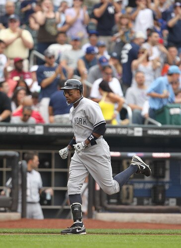 NEW YORK, NY - JULY 02:  Curtis Granderson #14 of the New York Yankees rounds the bases after hitting a home run in the sixth inning against the New York Mets during their game on July 2, 2011 at Citi Field in the Flushing neighborhood of the Queens borough of New York City.  <br /><br /><span class="help">(Photo by Al Bello/Getty Images)</span>