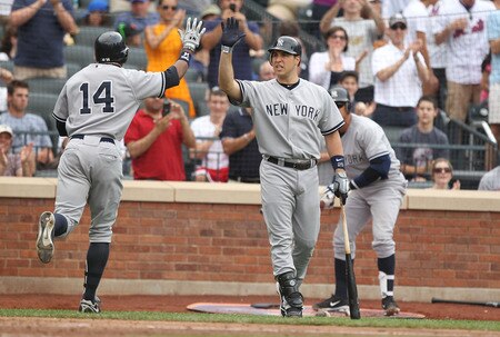 NEW YORK, NY - JULY 02:  Curtis Granderson #14 of the New York Yankees is met by Mark Teixeira #25 after hitting a home run in the sixth inning against the New York Mets during their game on July 2, 2011 at Citi Field in the Flushing neighborhood of the Queens borough of New York City.  <br /><br /><span class="help">(Photo by Al Bello/Getty Images)</span>